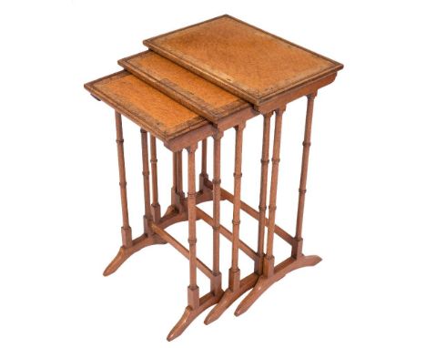 A nest of three mahogany, burr walnut and amboyna wood inlaid occasional tables:, bordered with boxwood lines, the rectangula