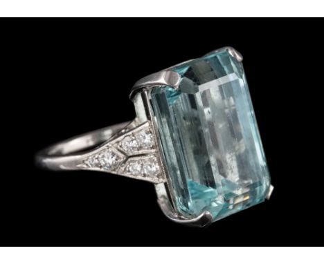 An aquamarine single-stone ring: the rectangular aquamarine approximately 17.6mm long x 12mm wide x 9.8mm deep, in four-claw 