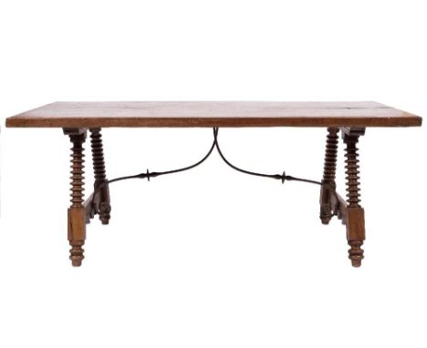 A Spanish walnut dining table in the 18th Century manner:, the rectangular top on bobbin turned tapered and splayed legs, uni