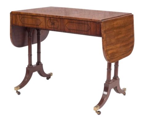 A Regency mahogany and inlaid sofa table:, bordered with lines, the hinged top with rounded corners, the frieze fitted with a