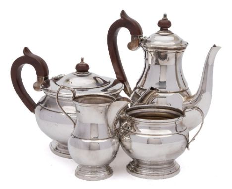 An Elizabeth II silver four-piece tea and coffee service, maker Cooper Brothers &amp; Sons Ltd, Sheffield, 1973: of plain cir