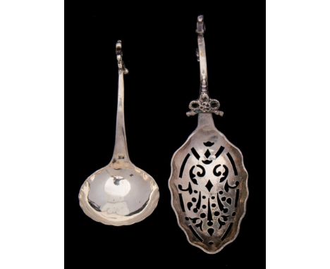 A 19th century Dutch silver sifting spoon, stamped marks: together with a small Continental silver sauce ladle, total weight 
