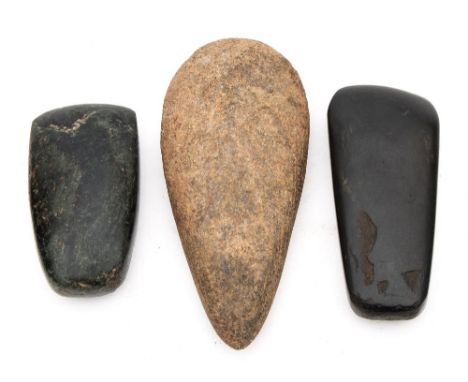 Two European Neolithic polished stone axe heads and an unpolished example circa 350 BC:.