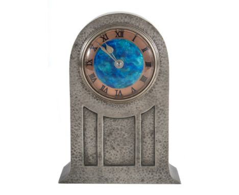 A Liberty &amp; Co Tudric pewter mantel clock: designed by David Veasey, London, circa 1902, the eight-day duration French ti