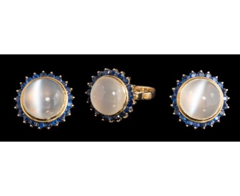 A cat's eye moonstone and sapphire circular cluster ring with matching ear-clips: each ear-clip with a central cat's eye moon