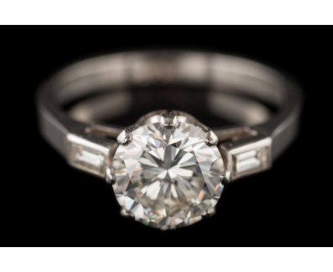 A diamond single-stone ring: the round brilliant-cut diamond approximately 7.3mm diameter x 4.3mm deep, estimated to weigh a 