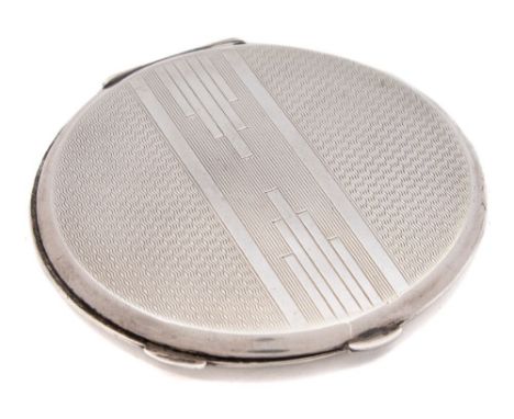 A George VI silver powder compact, maker J T Deeley, Birmingham, 1945: crested, of circular outline with engine turned decora