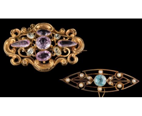 A 19th century gold, pink topaz and chrysolite mounted oval brooch: with central round pink topaz 8mm diameter within a scrol