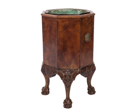 A carved and burr walnut octagonal jardiniere:, in the 18th Century taste, having a brass liner and beaded ring handles to th