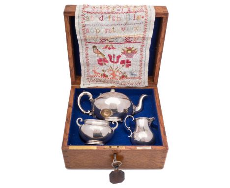 A Victorian silver presentation three-piece tea service, maker Edward & John Barnard, London, 1861: bears Royal cyphers for V