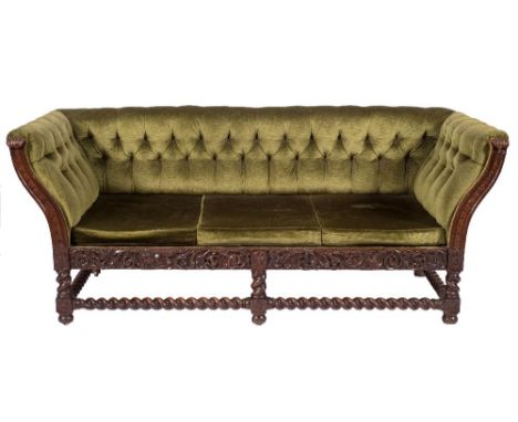 A late 19th Century carved oak three seat settee in the Carolean taste:, having a rectangular upholstered stuff over button d