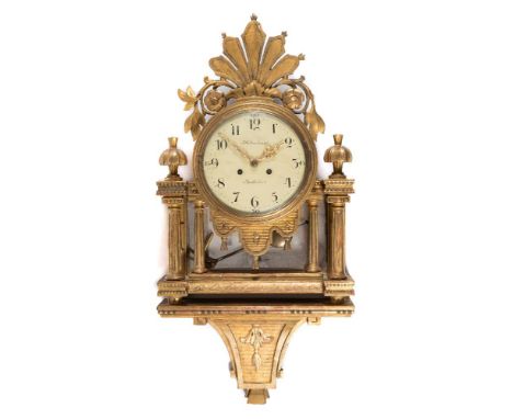 F.W. Tornberg, Stockholm, a giltwood wall clock: with an eight-day duration movement striking on a bell and stamped with the 