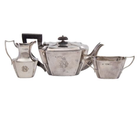 A Victorian  silver three-piece bachelor's tea service, maker William Hutton &amp; Sons Ltd, London, 1895: monogrammed, of re