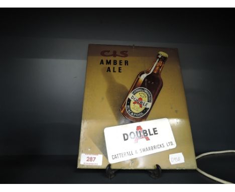 A vintage tin advertising sign for C &amp; S Amber Ale