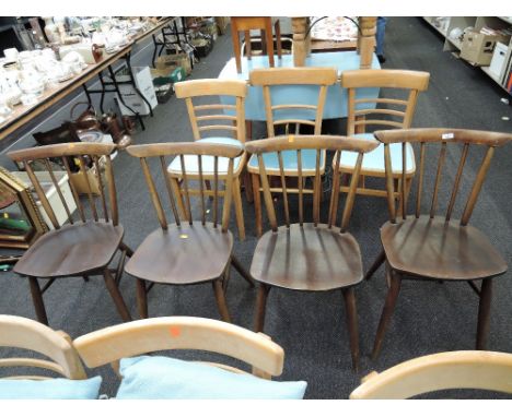 A set of 4 dark stained Ercol style spindle back kitchen chairs