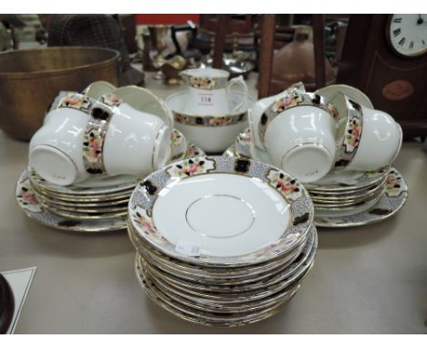 a vintage part tea service un marked with hand decorated edgework
