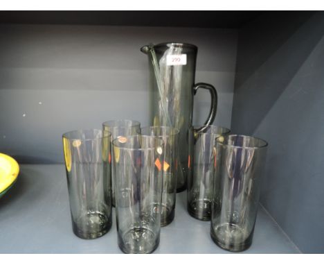 A vintage black glass Sangria jug or pitcher and glass set