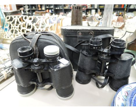 Two sets of vintage binoculars including Yashica and Photax