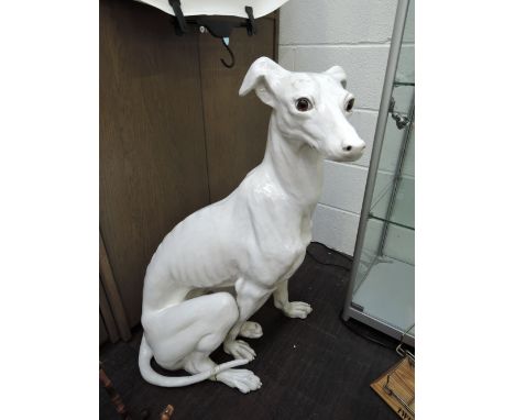 a large white glaze ceramic dog figure of a grey hound slight break to foot