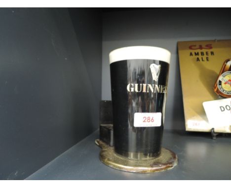 A vintage bar advertising light for Guinness Irish beer 