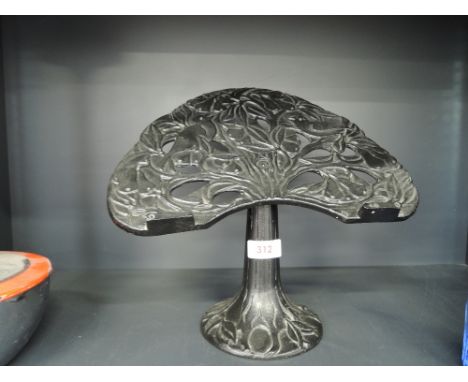 A vintage cast iron art nouveau design recipe or book stand