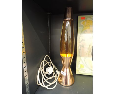 A vintage 1970's style lava lamp with copper effect base and top