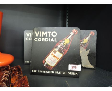 A selection of vintage tin shop advertising display stands for Vimto 