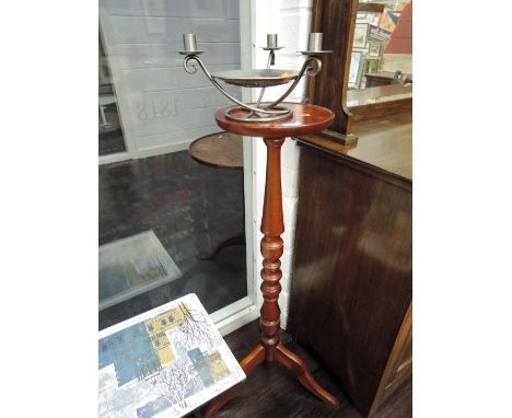 A reproduction torchere stand and modern arts and crafts style 3 branch candlestick