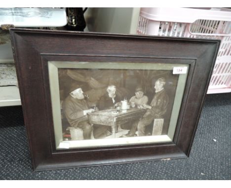 a vintage photograph of working men playing cards