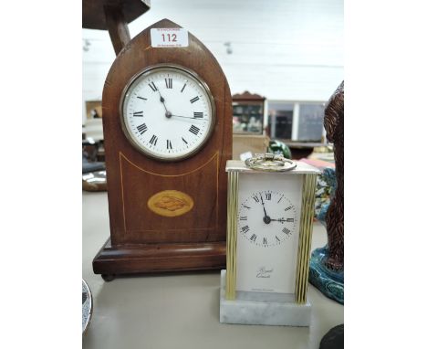 Two vintage clocks one wooden in a bishops hat design and carriage clock