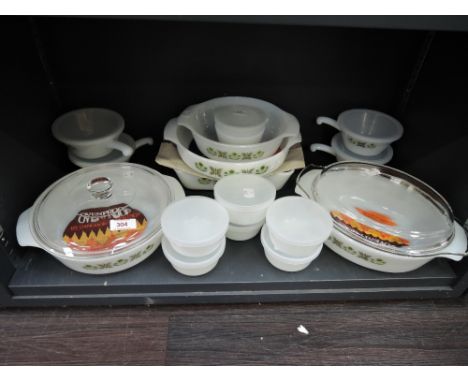 A selection of vintage pressed glass kitchen wares by Fire King