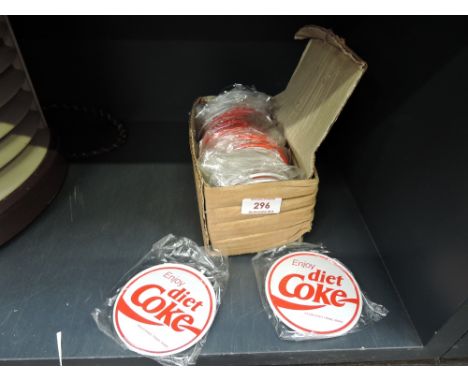 A selection of vintage Coca Cola drinks coasters