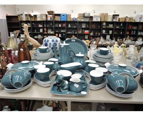 A large part dinner tea coffee service by Pool pottery in a teal two tone design