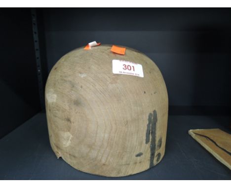 A vintage wooden hat or similar mould