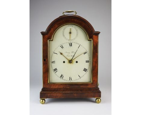 A Regency mahogany bracket clock by Henry Favre,Pall Mall, London, the arched pad top case with gilt brass carrying handle, t