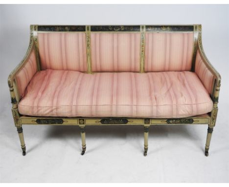 An early 19 th century cream and florally painted Neoclassical sofa later upholstered salmon pink striped triple panel back a