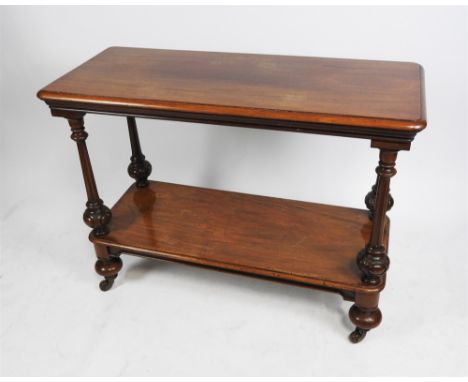 A Victorian mahogany two-tier buffet, mid-19 th century, the rectangular top raised on fluted and bolection cut ball pilaster