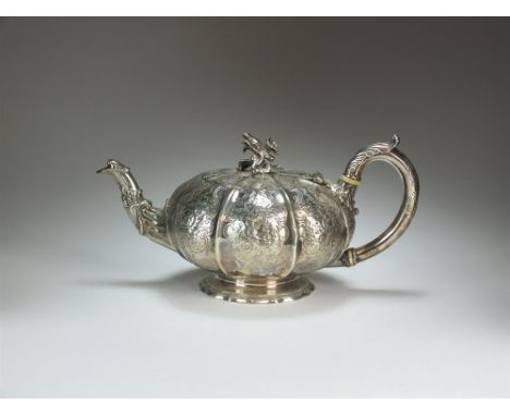 A Paul Storr silver teapot, London 1834, of melon form with embossed floral decoration, engraved initials, floral cast finial