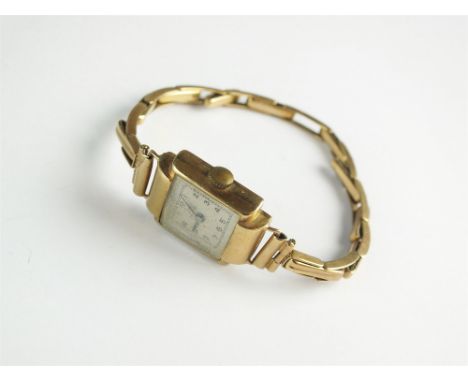 A Lady's 9ct gold Record wristwatch, the square silvered dial with Arabic numerals, manual wind, with attached 9ct gold expan