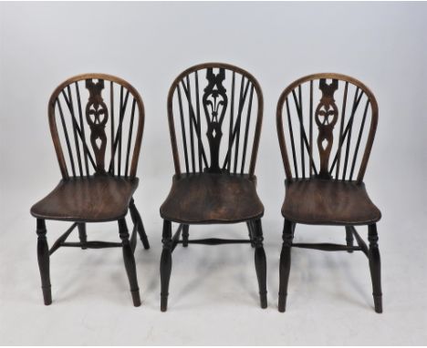 A harlequin set of five elm and ash stick back single chairs, 19th century, each with fleur-de-lis pierced vase splat and elm