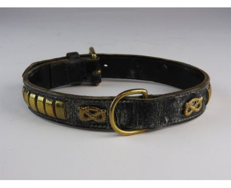 A leather and brass dog collar, applied with a gordian knot, also four inscribed brass name plates and a brass mounted grain 