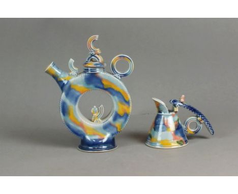 Steve Woodhead (British, 1956) a teapot and cover together with a similar jug in orange, red and blue glazes, potters seal im