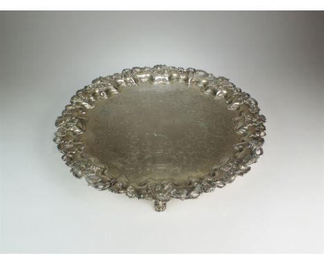 A large silver salver, Walker &amp; Hall, Sheffield 1906, of circular form with bright cut engraved decoration to the centre 