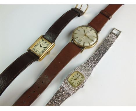 A Gentleman's 9ct gold Rotary automatic automatic date watch, the silvered dial with batons and date aperture, with attached 