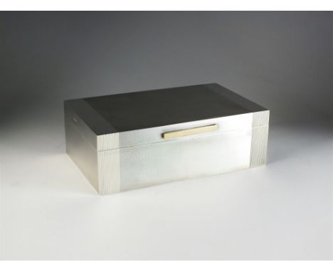 A large silver mounted cigar box, Padgett &amp; Braham Ltd, London 1958, of rectangular engine turned design with yellow meta