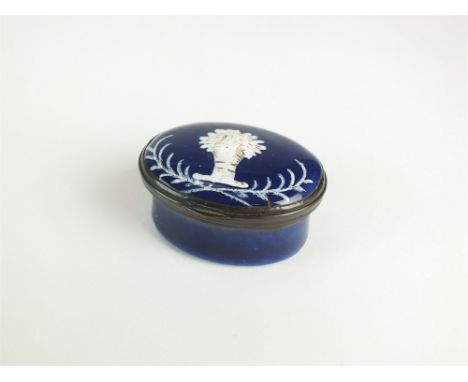 A late 18th/early 19th century Staffordshire enamel patch box, of typical hinged oval shape, the cover decorated with central