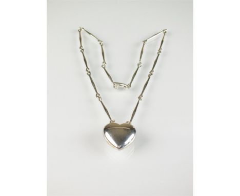 A Georg Jensen silver 'Joy heart' necklace, the silver heart stamped '925 Denmark George Jensen 126B', suspended from elongat