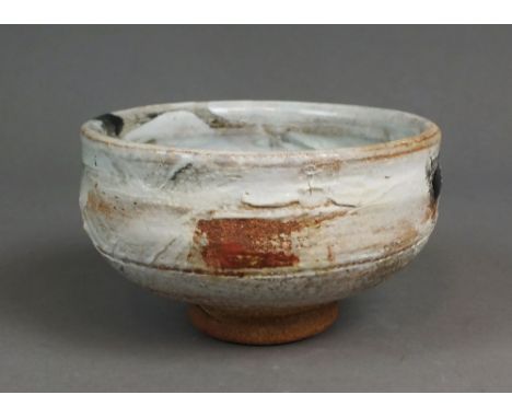 Robin Welch (British, born 1936) a small stoneware bowl, with some lustre to glaze and red splash to interior, impressed seal