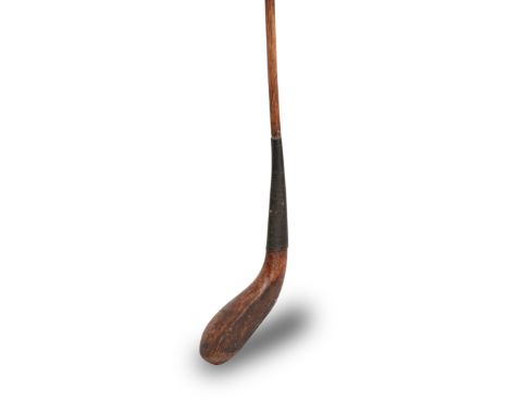 TOM HOOD: A LONG NOSE SPOON, CIRCA 1870A lightly stained fruit wood club head with script capital letters 'T Hood' stamped on