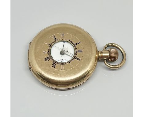 A gold plated Dennison pocket watch (glass cracked and faults).